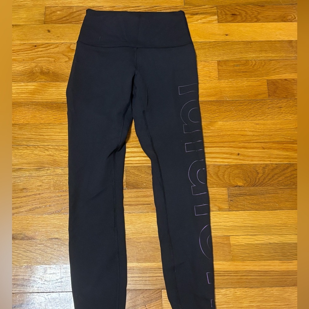 Black Lululemon Leggings with Purple Side Logo
Size: 4